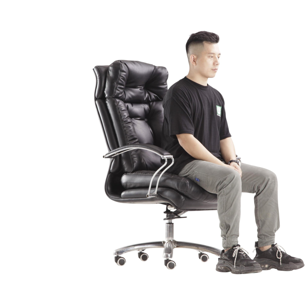 Xiaoyaozuo office chair: Black executive faux leather office chair with plush cushioning, high backrest, and chrome armrests. Ergonomic design with smooth-rolling casters.