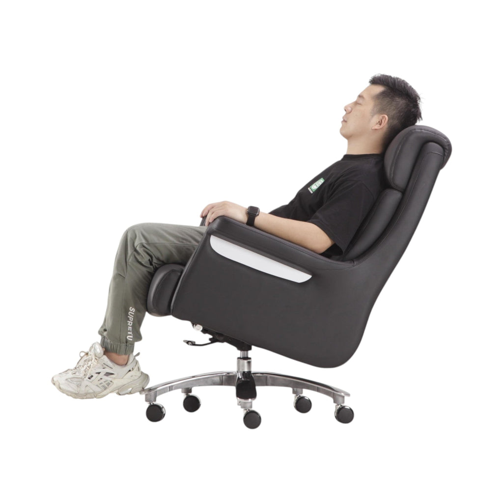 Xiaoyaozuo office chair: Black faux leather executive chair with high back, plush cushioning, and chrome accents. Ergonomic design with adjustable height and casters.
