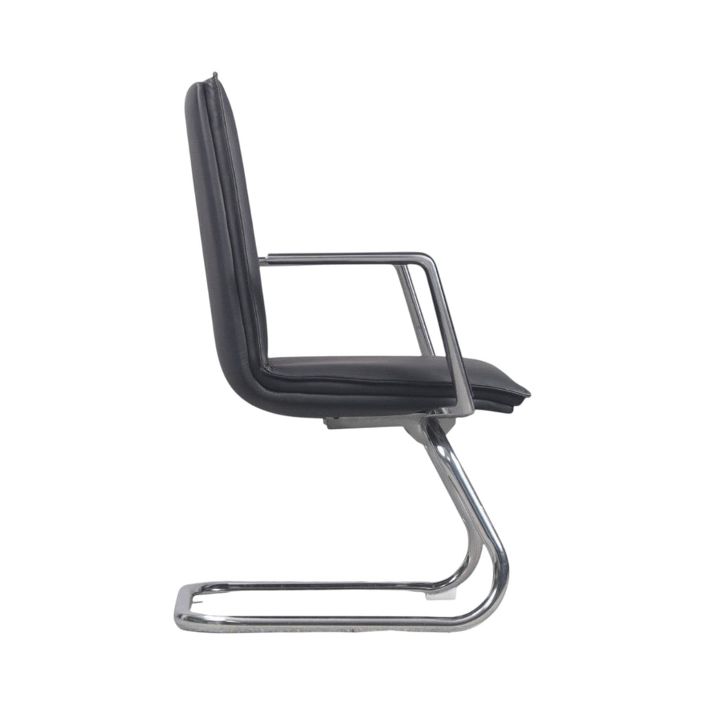 Xiaoyaozuo office chair black faux leather executive chair with polished chrome cantilever base and armrests.