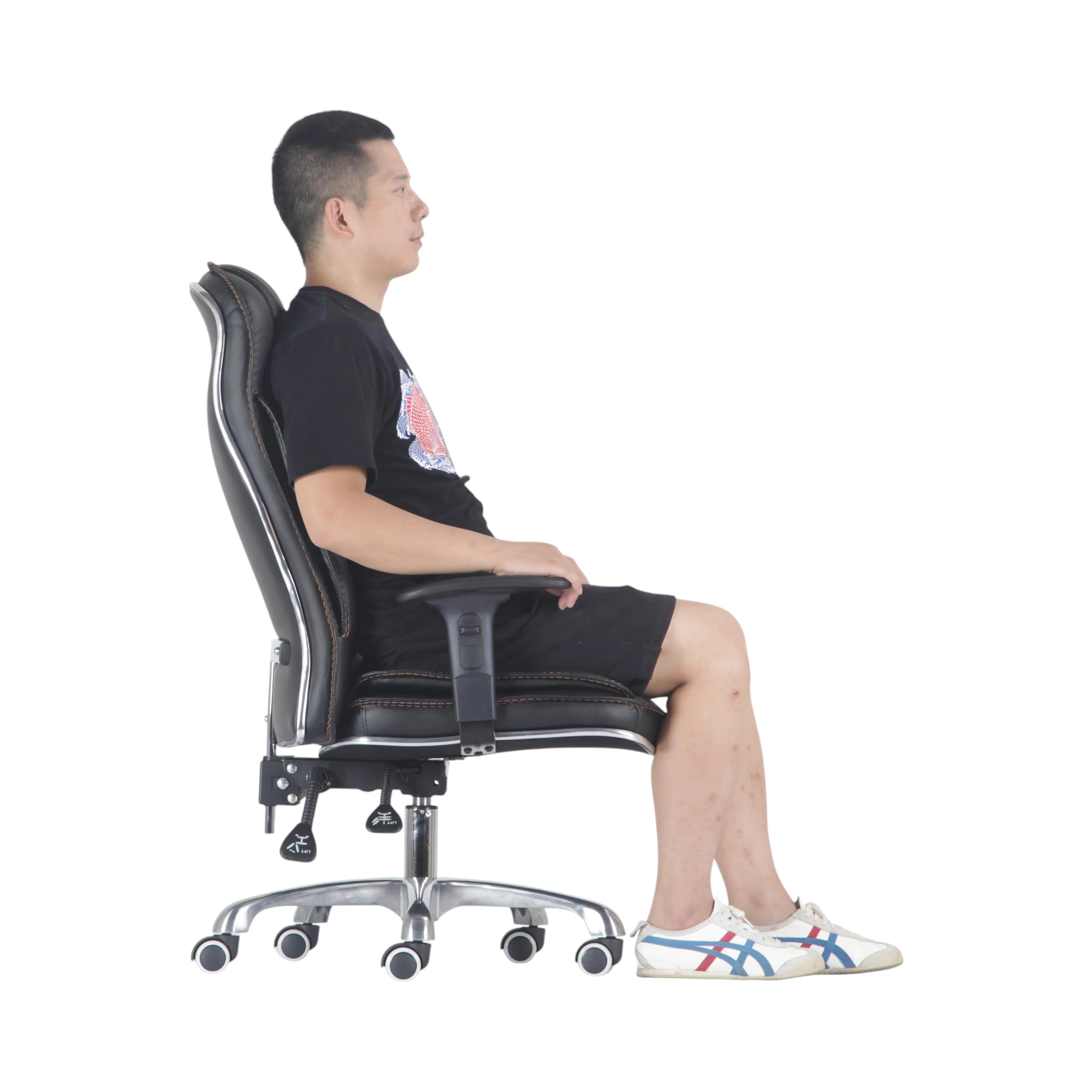 Xiaoyaozuo office chair: Black faux leather executive chair with high back, contrast stitching, and chrome base with casters. Man seated.
