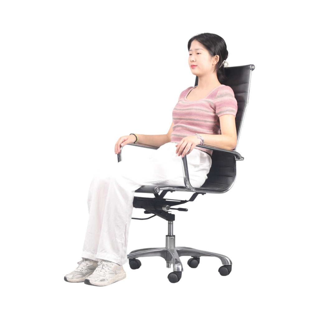 Xiaoyaozuo office chair: Black faux leather executive high back office chair with polished aluminum base and casters.