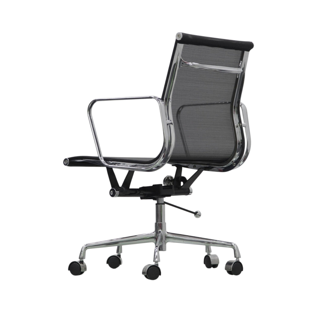 Xiaoyaozuo office chair, modern black mesh ergonomic office chair with polished chrome frame and arms, on casters.