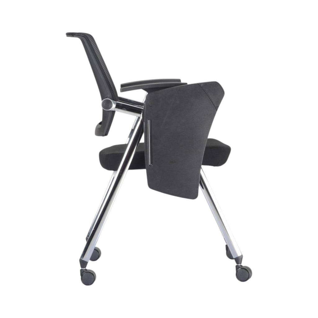Xiaoyaozuo office chair black mesh training chair with flip-up writing tablet and chrome base on casters.
