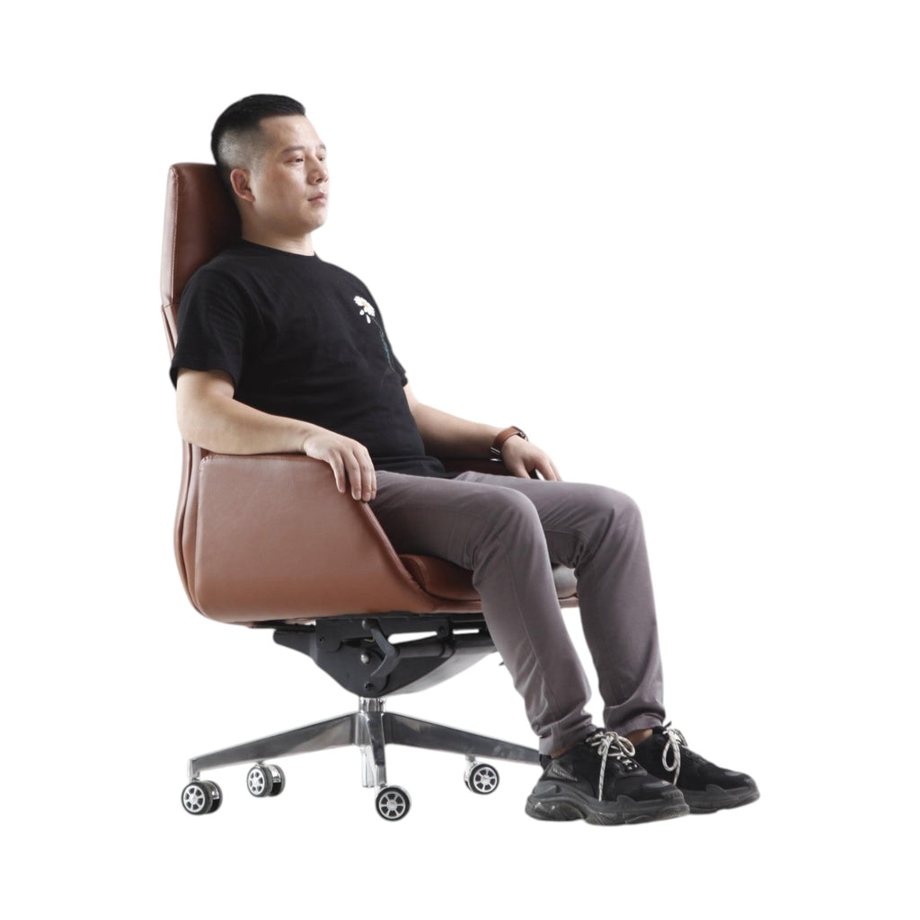 Xiaoyaozuo office chair executive high back chair in brown faux leather with polished metal base and casters, man seated.