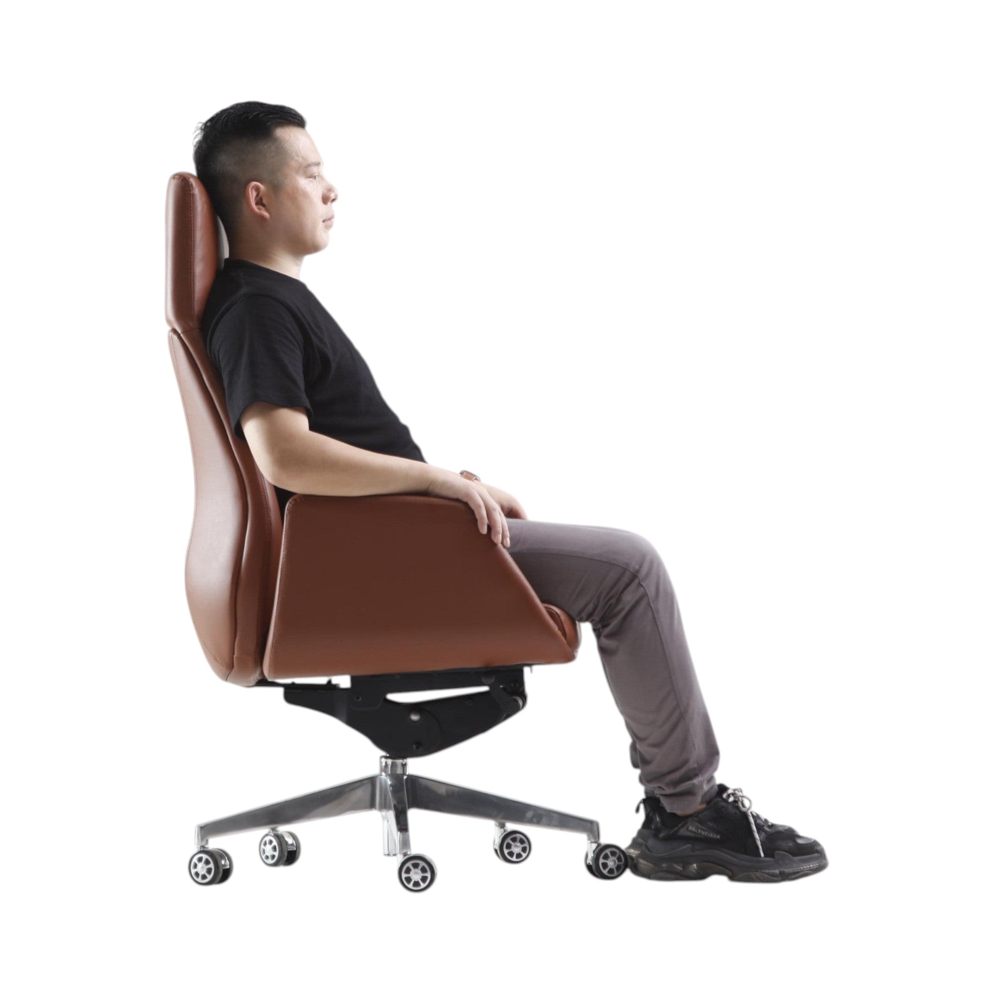 Xiaoyaozuo office chair executive high back chair in brown faux leather with polished metal base and casters, man seated.