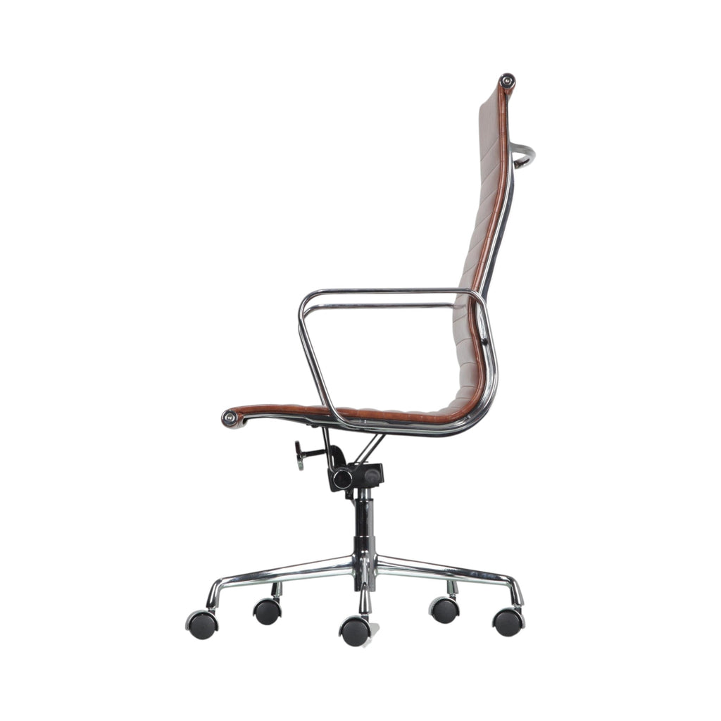 Xiaoyaozuo office chair executive high back chair in brown faux leather with chrome base and casters.