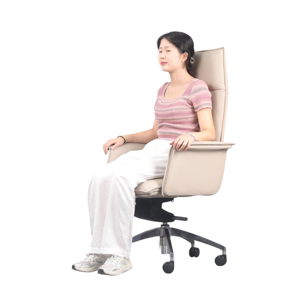 Xiaoyaozuo office chair executive high back chair in cream faux leather with chrome base and casters, shown with a woman seated.
