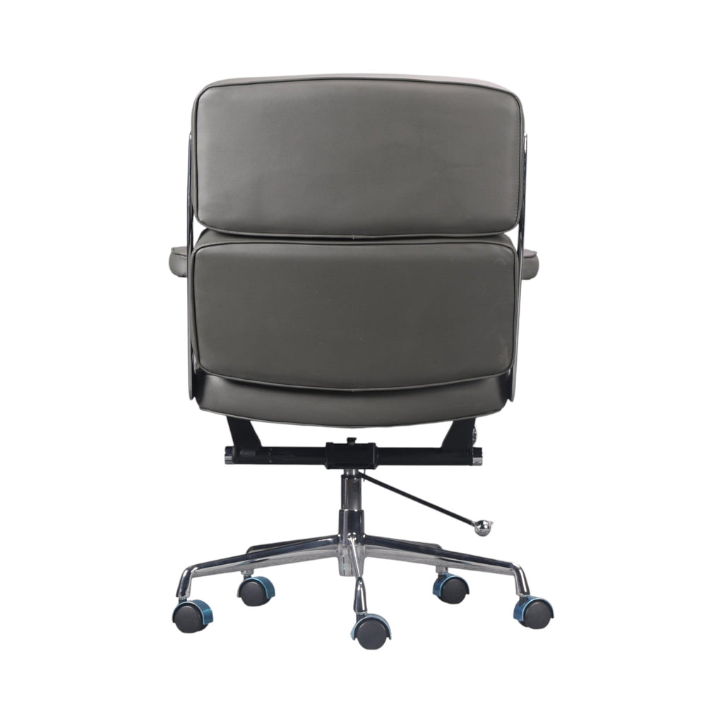 Xiaoyaozuo office chair executive management chair in dark grey faux leather with tufted back and chrome base with casters.