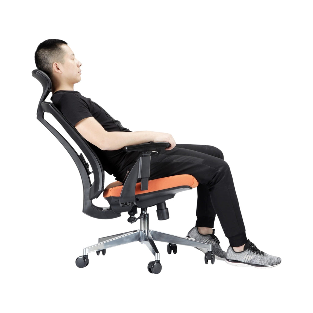 Xiaoyaozuo office chair: Man relaxing in an ergonomic mesh office chair with orange seat and adjustable headrest.