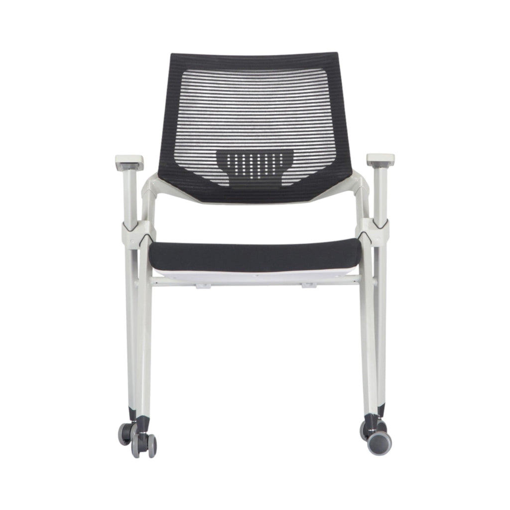 Xiaoyaozuo office chair: modern white frame ergonomic mesh back chair with black padded seat and wheels.
