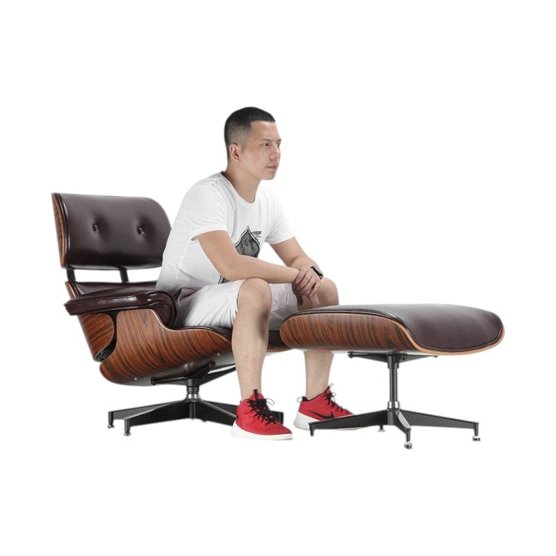 Xiaoyaozuo office chair executive lounge chair with brown leather upholstery and wood veneer shell, shown with ottoman.