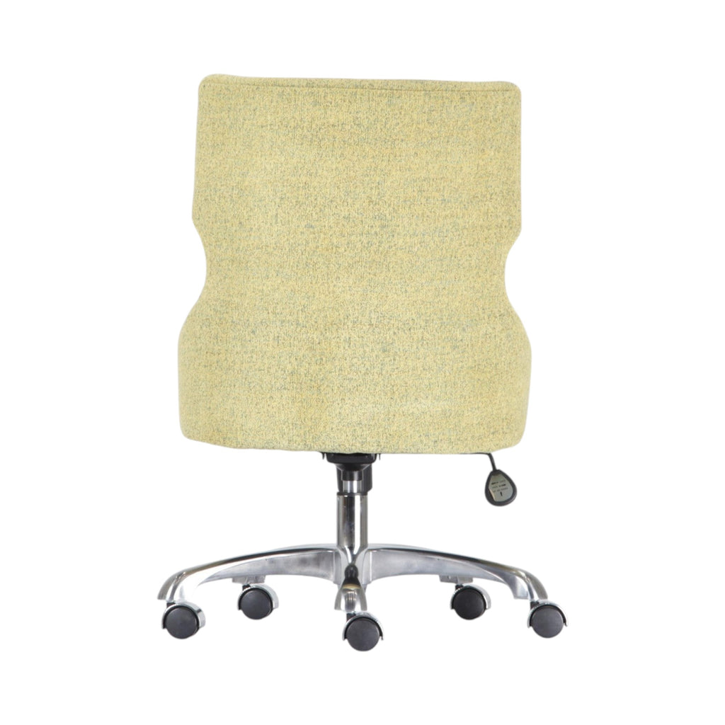 Xiaoyaozuo office chair in light yellow textured fabric with ergonomic design and chrome base with casters.