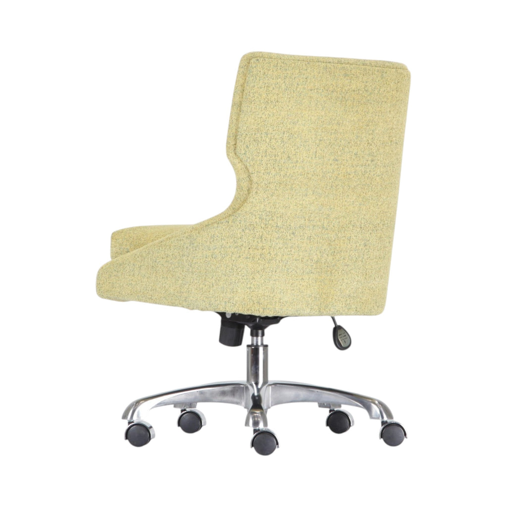 Xiaoyaozuo office chair in light yellow textured fabric with ergonomic design and chrome base with casters.