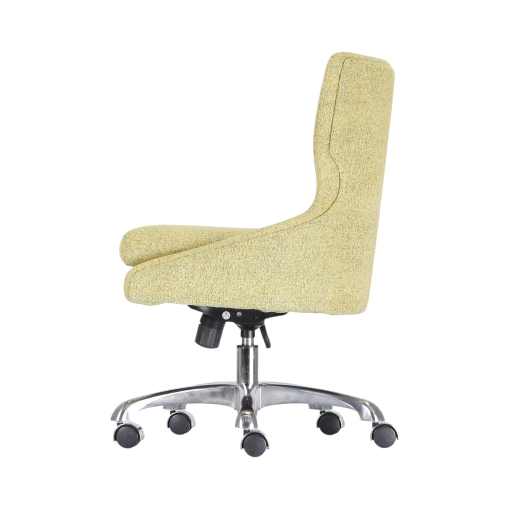 Xiaoyaozuo office chair in light yellow textured fabric with ergonomic design and chrome base with casters.
