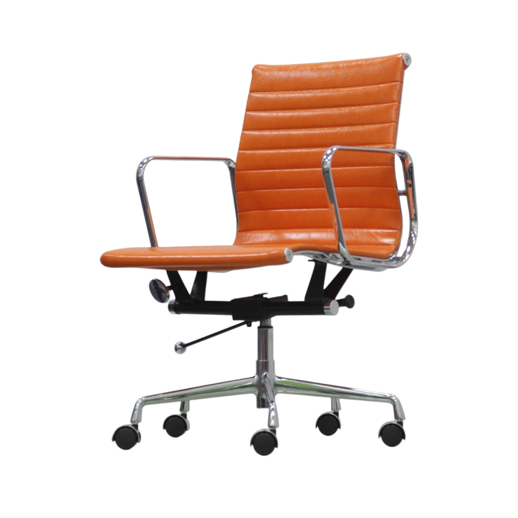 Xiaoyaozuo office chair orange faux leather executive chair with chrome armrests and base, ribbed seat and back, on casters.