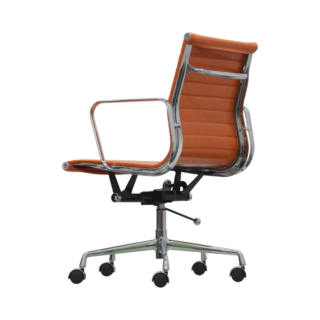 Xiaoyaozuo office chair orange faux leather executive chair with chrome frame and armrests, on casters.
