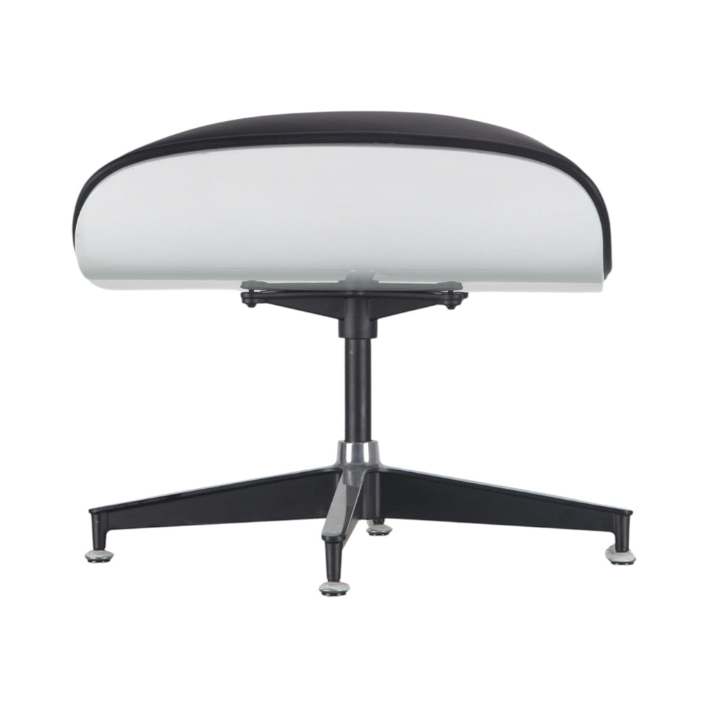Xiaoyaozuo office chair: White molded shell lounge chair with black leather upholstery and swivel base.