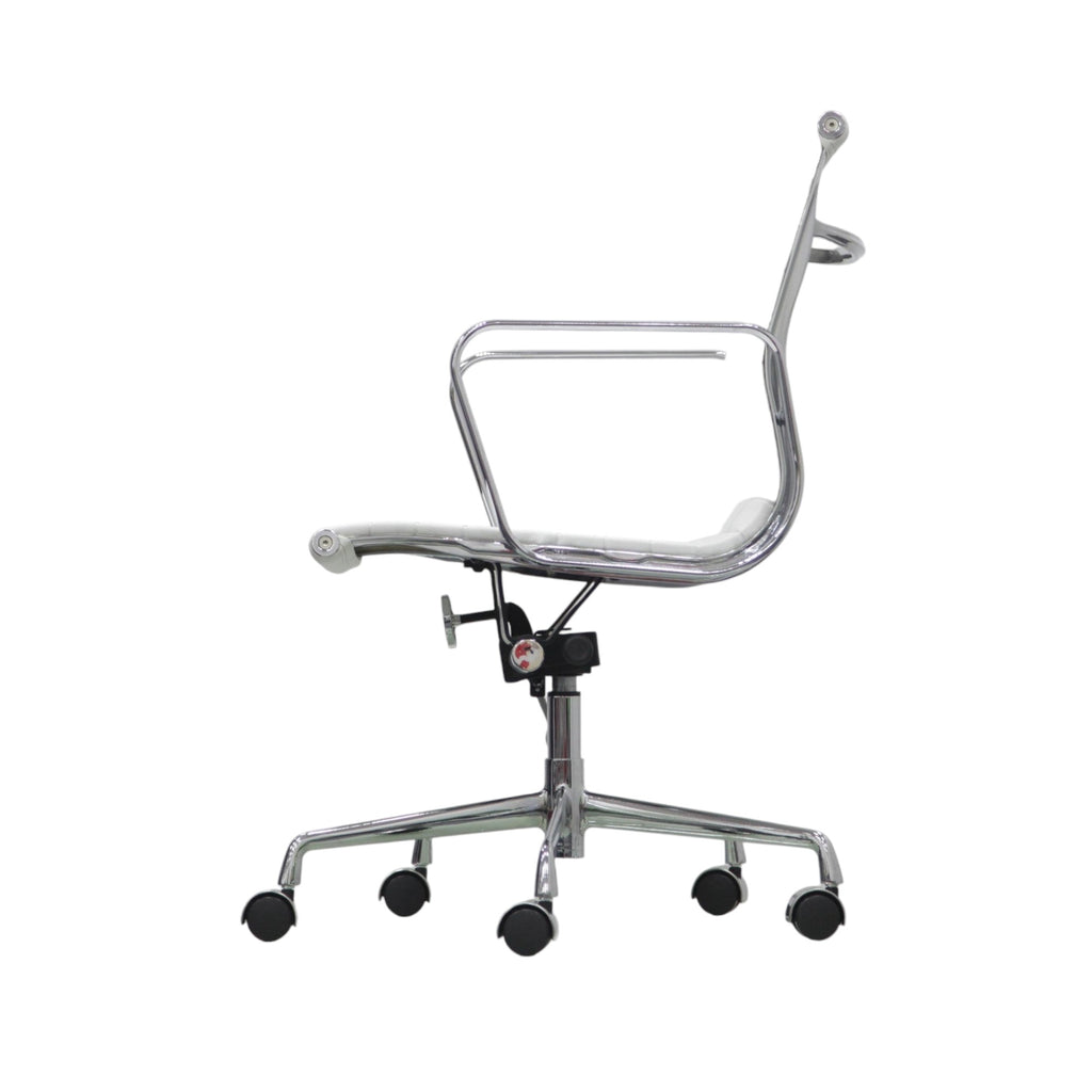 Xiaoyaozuo office chair: White faux leather executive office chair with chrome armrests and base, featuring horizontal stitching and casters.