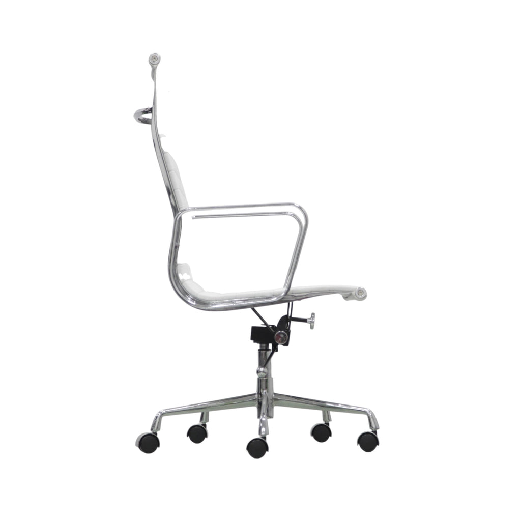 Xiaoyaozuo office chair: White faux leather executive chair with ribbed cushioning and polished chrome frame. High back, armrests, and rolling casters.