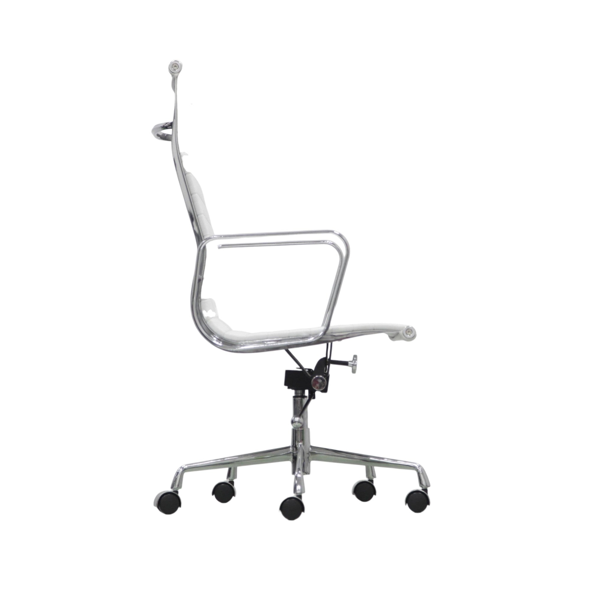 Xiaoyaozuo office chair: White faux leather executive chair with ribbed cushioning and polished chrome frame. High back, armrests, and rolling casters.