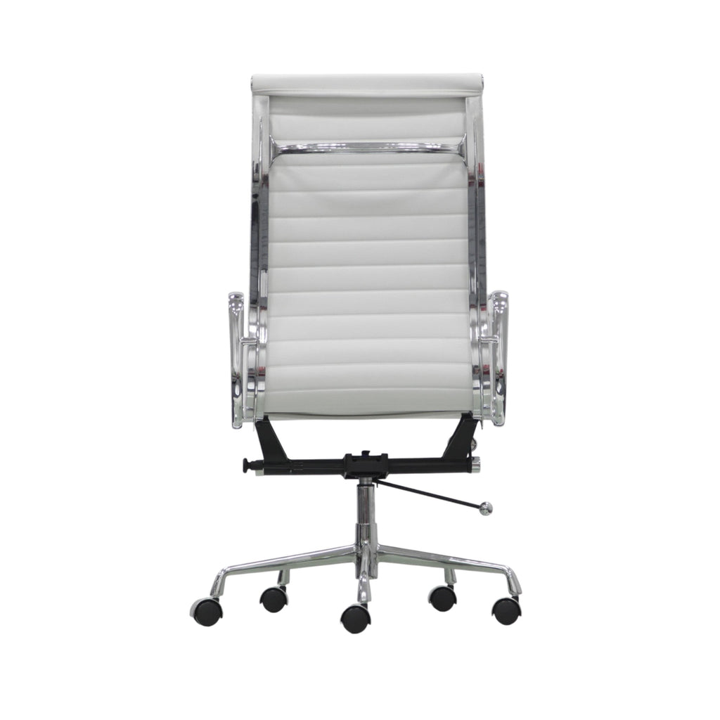 Xiaoyaozuo office chair: White faux leather executive chair with ribbed cushioning and polished chrome frame, high back, adjustable height, and casters.