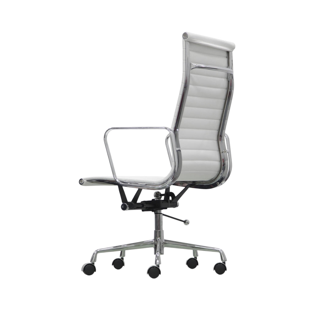 Xiaoyaozuo office chair: White faux leather executive chair with ribbed high back and polished chrome frame, adjustable height, and casters.